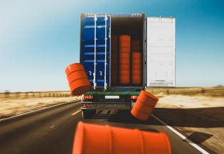 Barrels falling out of a truck