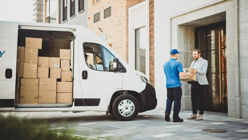 LCV dropping off a package from a last mile delivery